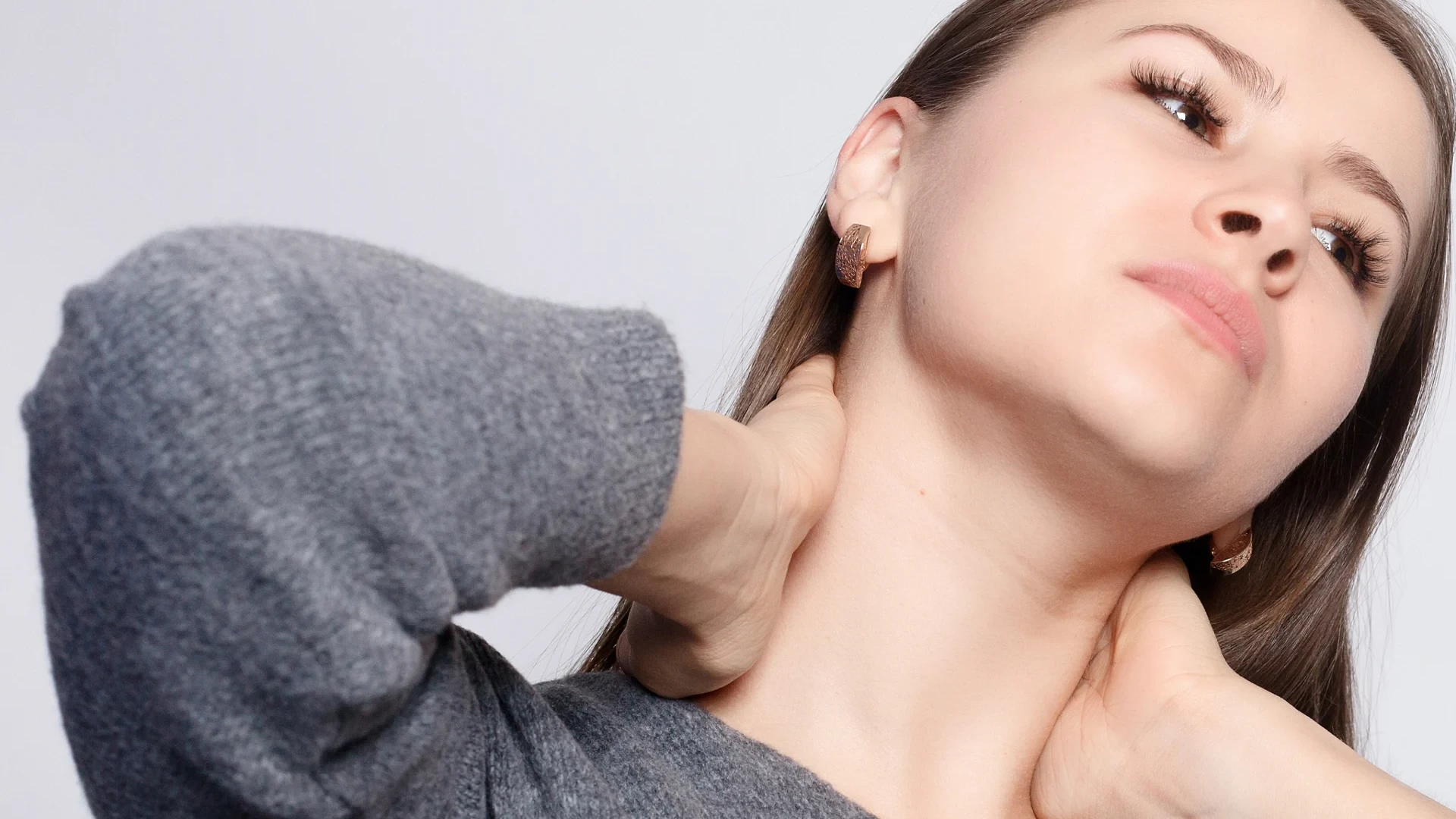 Young woman is suffering from Whiplash sustained in a car accident.